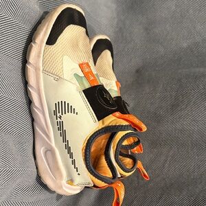 Nike Kids' Cream and Black Sneakers with Orange Accents